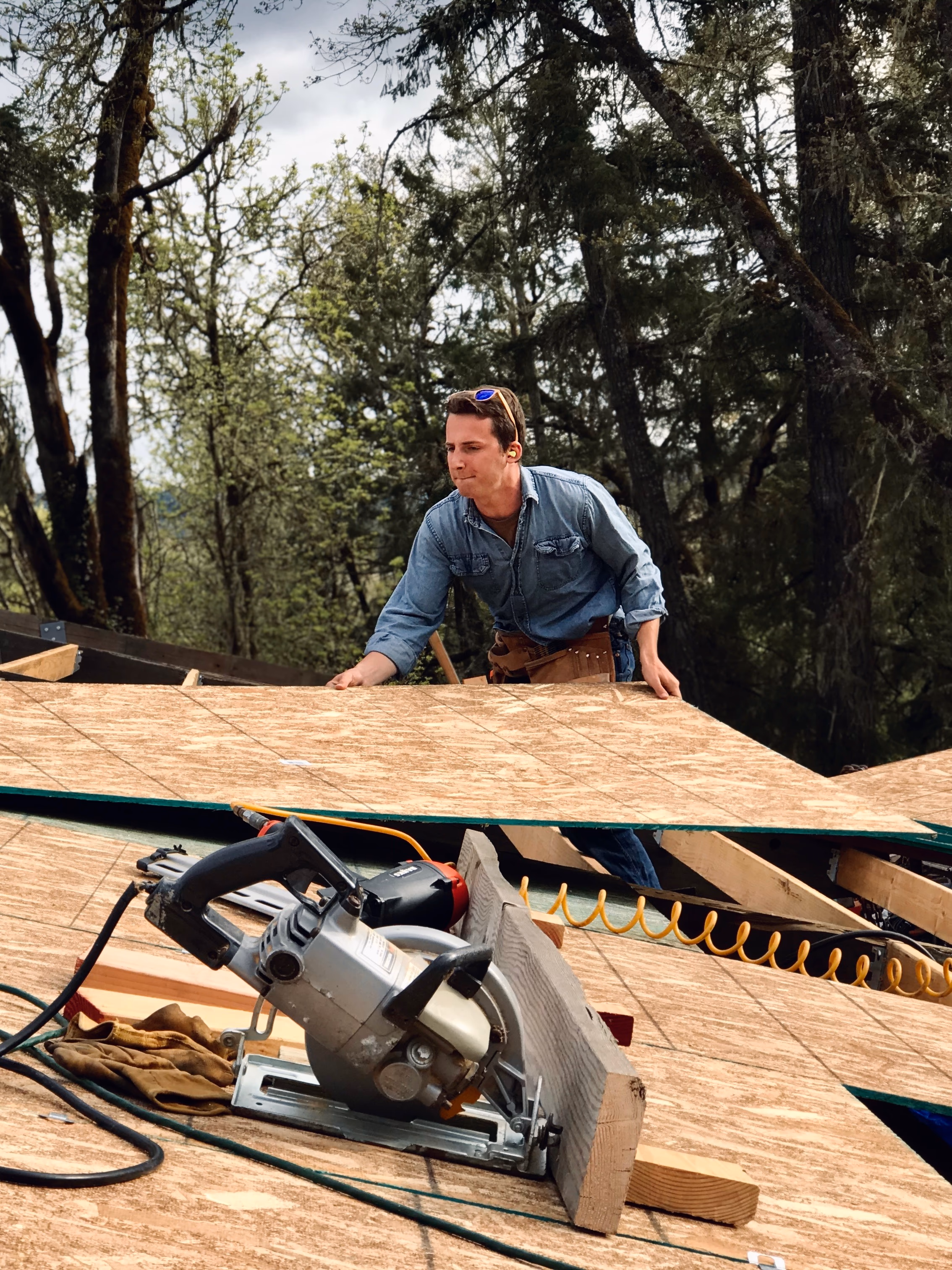 Contractor working on roof repairs — strategic improvement program by Aaron Cherry Real Estate, Douglas County Oregon